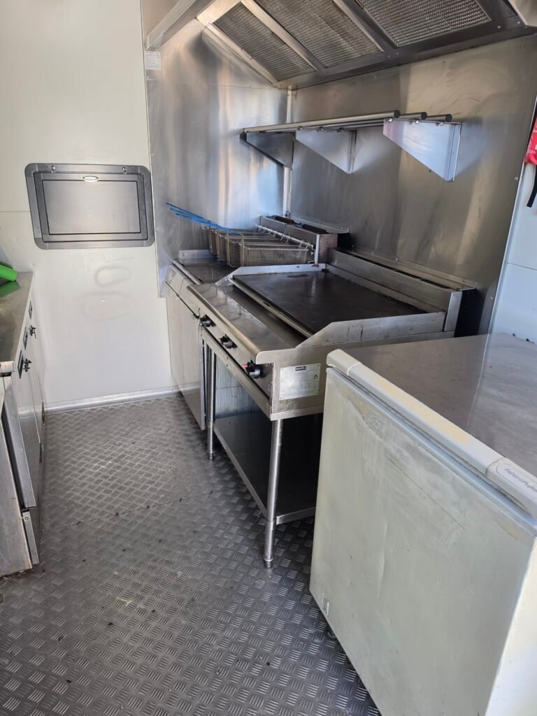 Gas cooktop and griddle installation inside a mobile food trailer kitchen by LTC Gas
