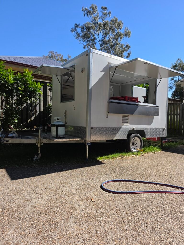 Exterior view of a mobile food trailer with LPG gas bottle mounted and gas line installed by LTC Gas
